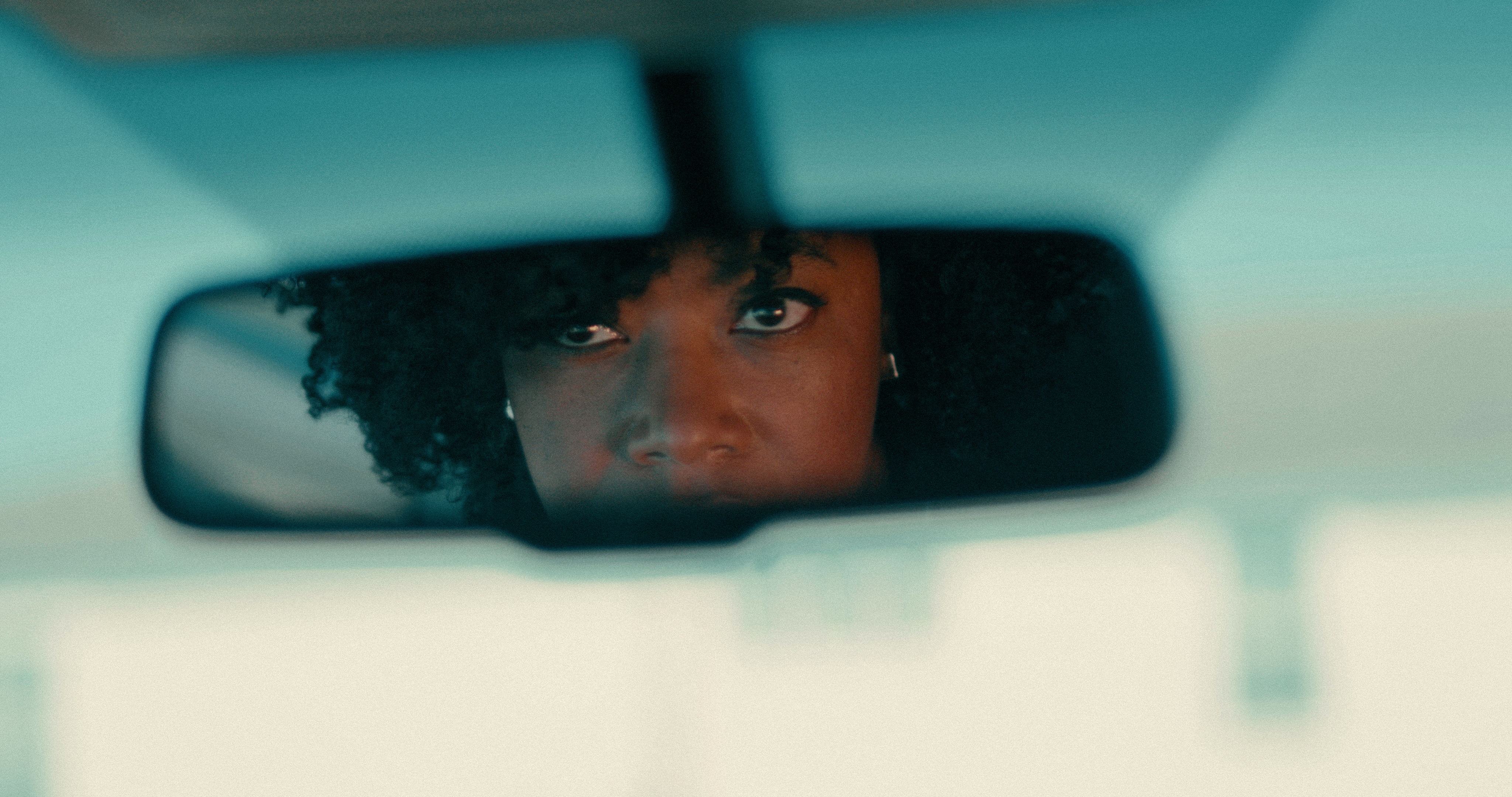 Lily looking in rearview mirror